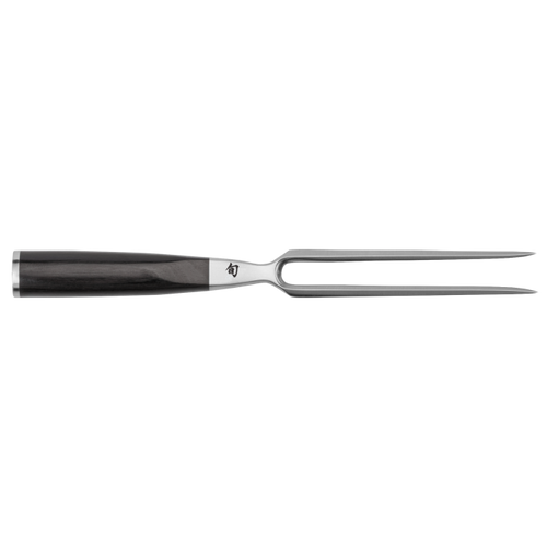 Stainless steel carving fork with black handle on a white background