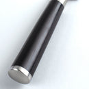 Close-up of a metallic knife handle with a silver base on a white background