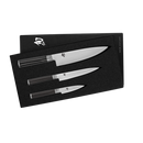 Set of three knives in a black box with a brand logo on a white background