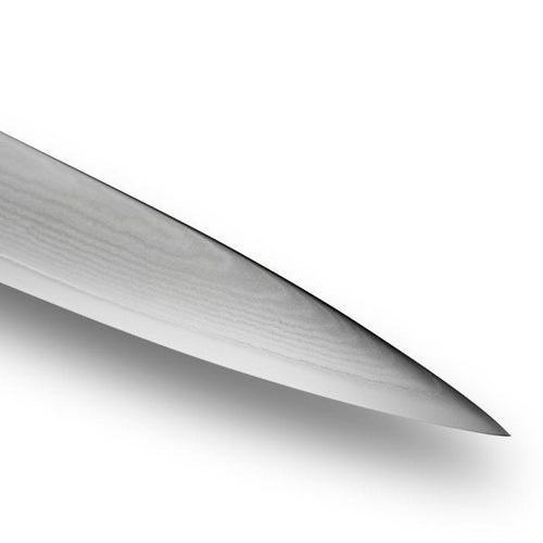 Close-up of a knife tip on a white background