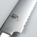Close-up of a chef's knife with a brand logo on a white background