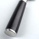 Close-up of a knife handle with metallic bottom on a light gray background