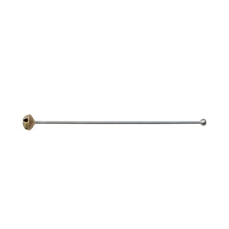 Metal cocktail stirrer with a gold cap on a white background