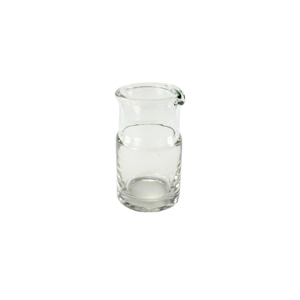 Clear glass carafe on a white background