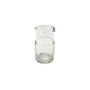 Clear glass carafe on a white background