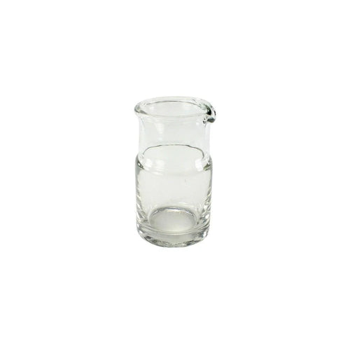Clear glass carafe on a white background