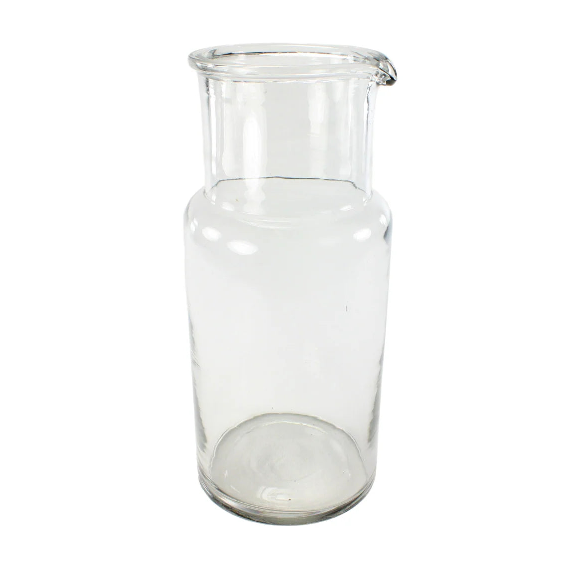 Clear glass carafe on a white background
