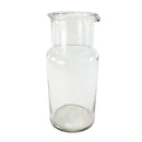 Clear glass carafe on a white background