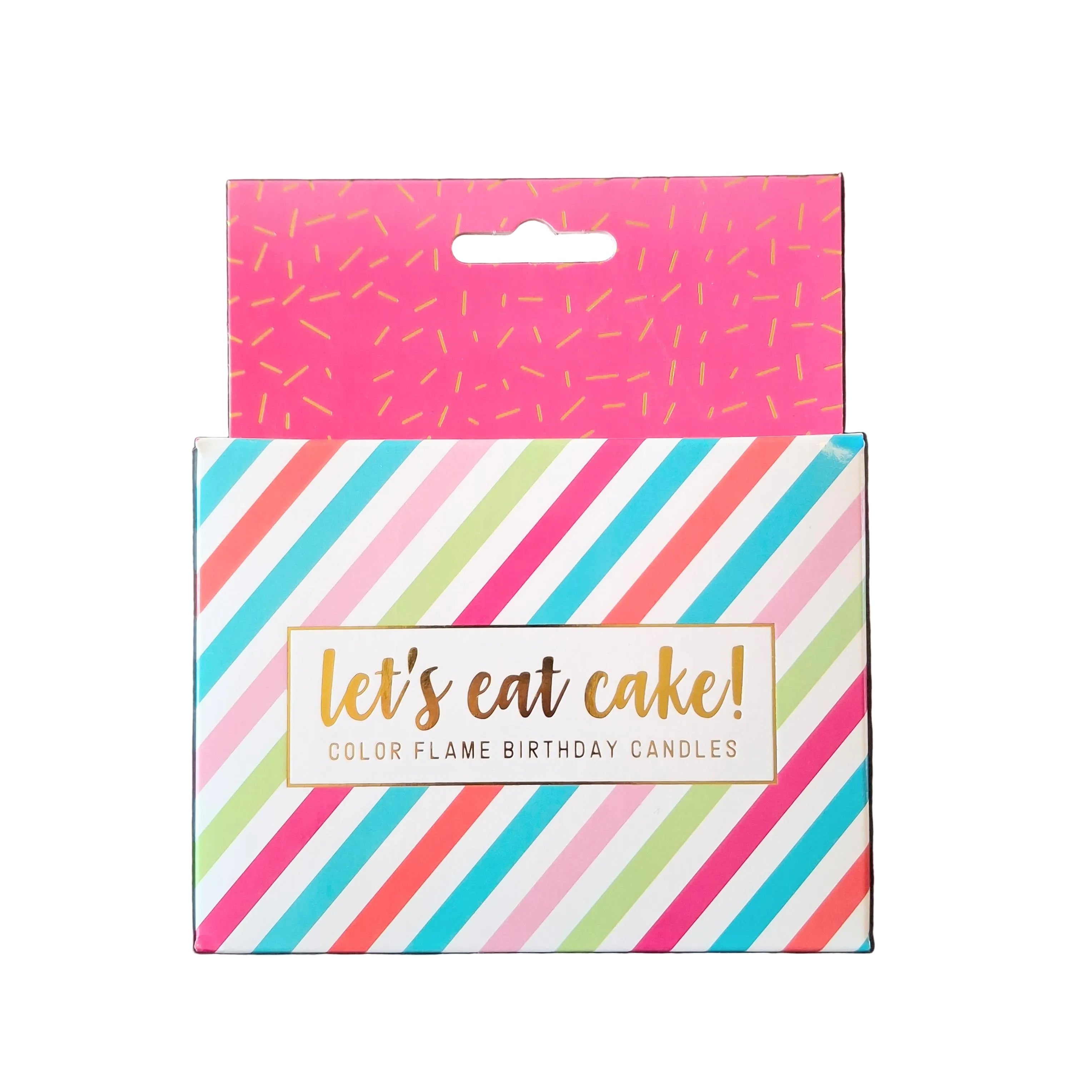 Two packages of birthday candles with colorful designs on a dark surface