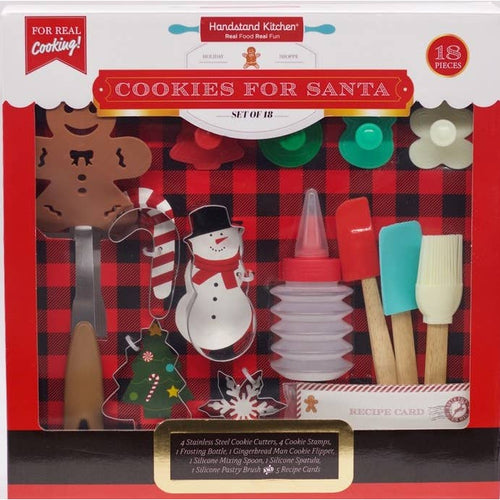 A Cookies for Santa baking set displayed in its packaging, including various cookie cutters, stamps, utensils, and a recipe book.
