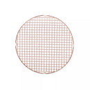 Round copper wire cooling rack on a white background