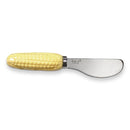 A ceramic corn-shaped spreader with a stainless steel blade and a yellow earthenware handle.