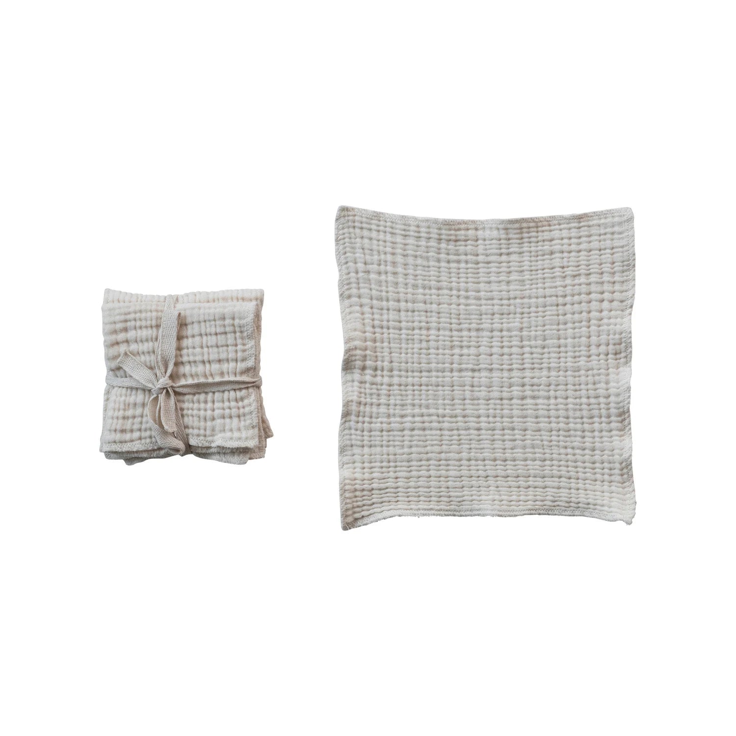 Folded textured kitchen dish cloths on a white background