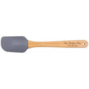 A silicon spatula with a gray head and a beige wooden handle with 'The Perfect Mix' and names 'Alex & Sara' printed on it.