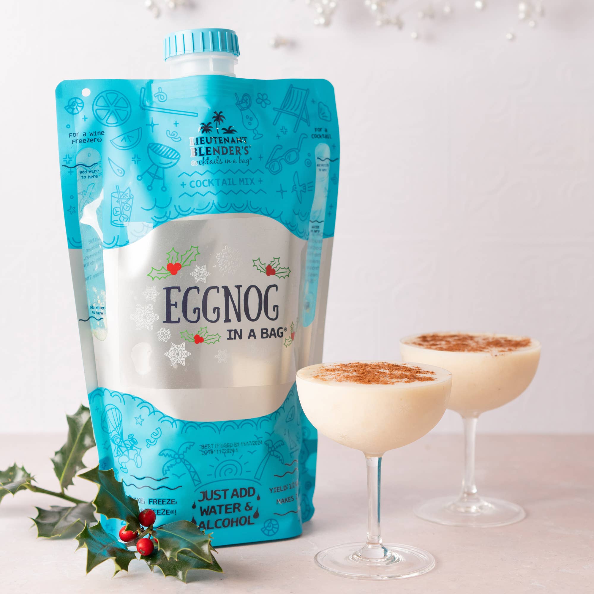 Eggnog in a bag with two glasses of eggnog on a white background
