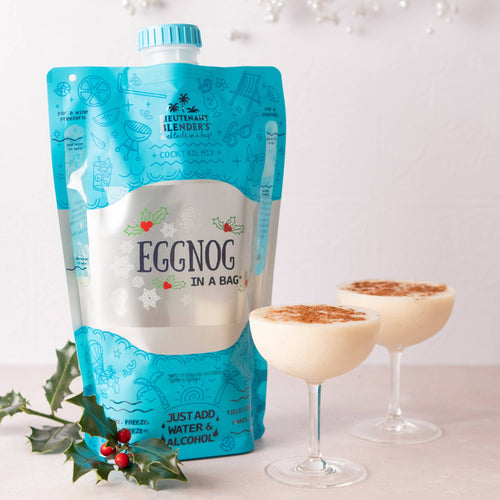 Eggnog in a bag with two glasses of eggnog on a white background