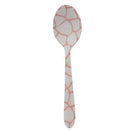 Spoon with pink and white geometric pattern on a white background