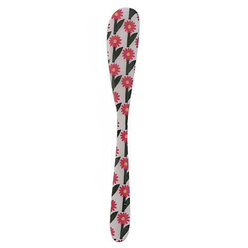 Canape knife with floral pattern on a white background