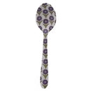 Spoon with purple floral pattern on a white background