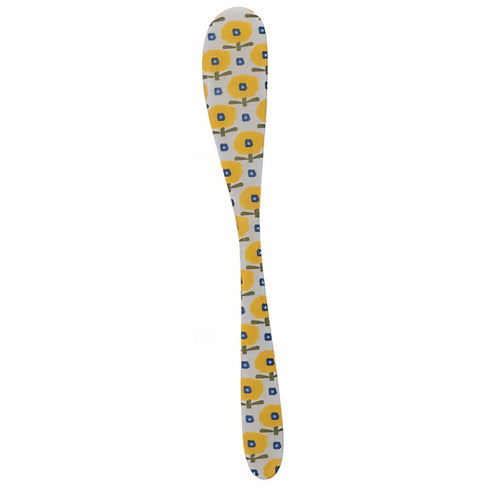 Decorative spoon with a yellow and blue floral pattern on a white background