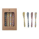 Set of four floral-patterned butter knives with a cardboard packaging box on a white background.