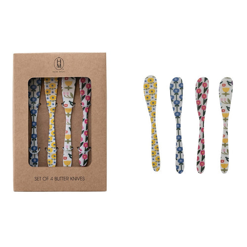 Set of four floral-patterned butter knives with a cardboard packaging box on a white background.