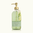 Bottle of Thymes Eucalyptus hand wash with a gold pump on a white background