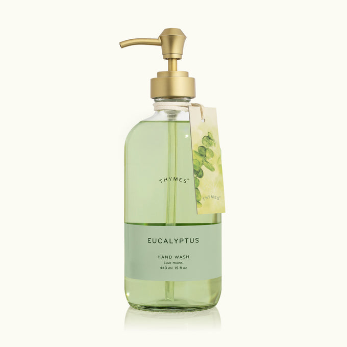 Bottle of Thymes Eucalyptus hand wash with a gold pump on a white background