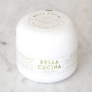 Bella Cucina body cream jar on a marble surface