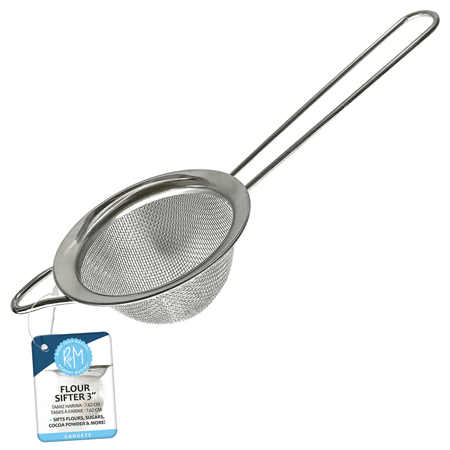 A stainless steel fine mesh wire flour sifter with a wire loop handle, displayed with a product label.