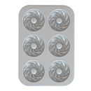 A French twist donut pan with a nonstick silver interior on a white background.