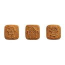 Three square cookies with decorative patterns on a white background