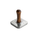 Metal cookie stamp with wooden handle on a white background