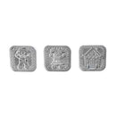 Three decorative metal cookie stamps featuring gingerbread man and house designs on a white background.