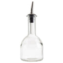 Glass bottle pourer for oil or similar liquids on a white background.
