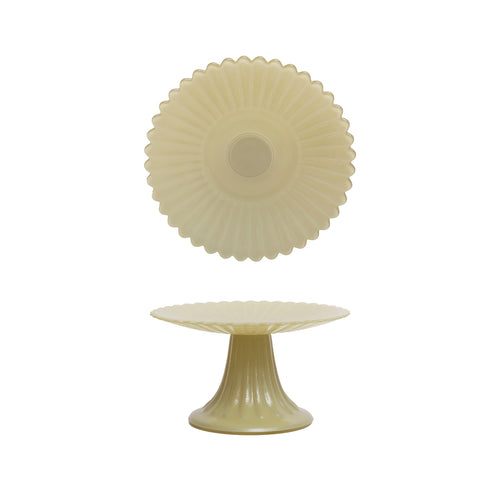 Decorative cake stand with a textured design on a white background