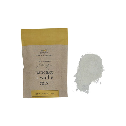 A package of Finch & Fennel Gluten-Free Ancient Grain Gluten-Free Pancake + Waffle Mix next to a small pile of the mix itself on a white background.