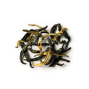 Dry black tea leaves on a white background