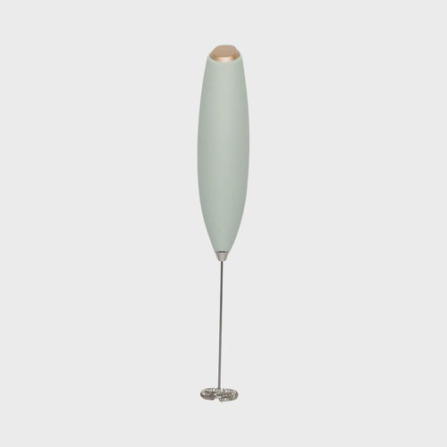 Portable milk frother on a white background.