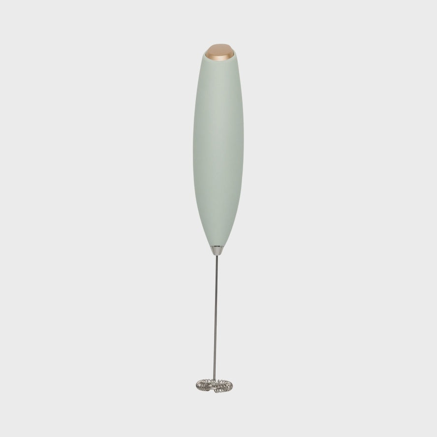 Portable milk frother on a white background.