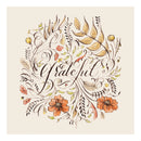 A napkin with autumn inspired artwork and 'grateful' in the center.