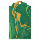A photo showing a marbled tag with green and gold patterns.