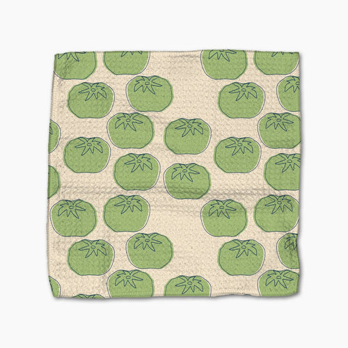 Beige towel with green tomato pattern on a white background
