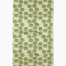 Tea towel with green tomato pattern on a beige background