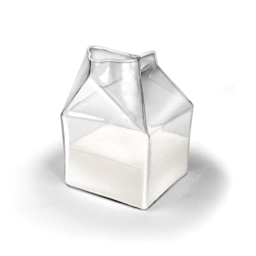 A clear glass creamer designed to resemble a mini milk carton, with a capacity for cream.