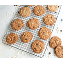 Oatmeal cookies with chocolate chips on a cooling rack
