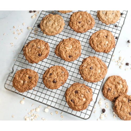 Oatmeal cookies with chocolate chips on a cooling rack