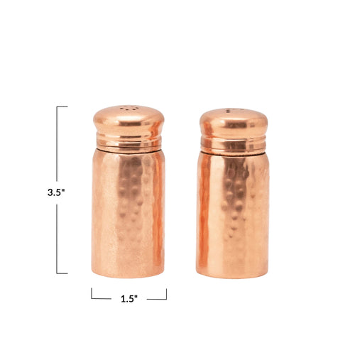 Two copper shakers with dimensions indicated on a white background