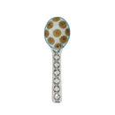 A hand painted ceramic spoon on a white background.
