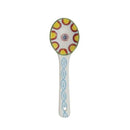 A hand painted ceramic spoon on a white background.